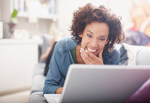 woman on laptop smiling-blog